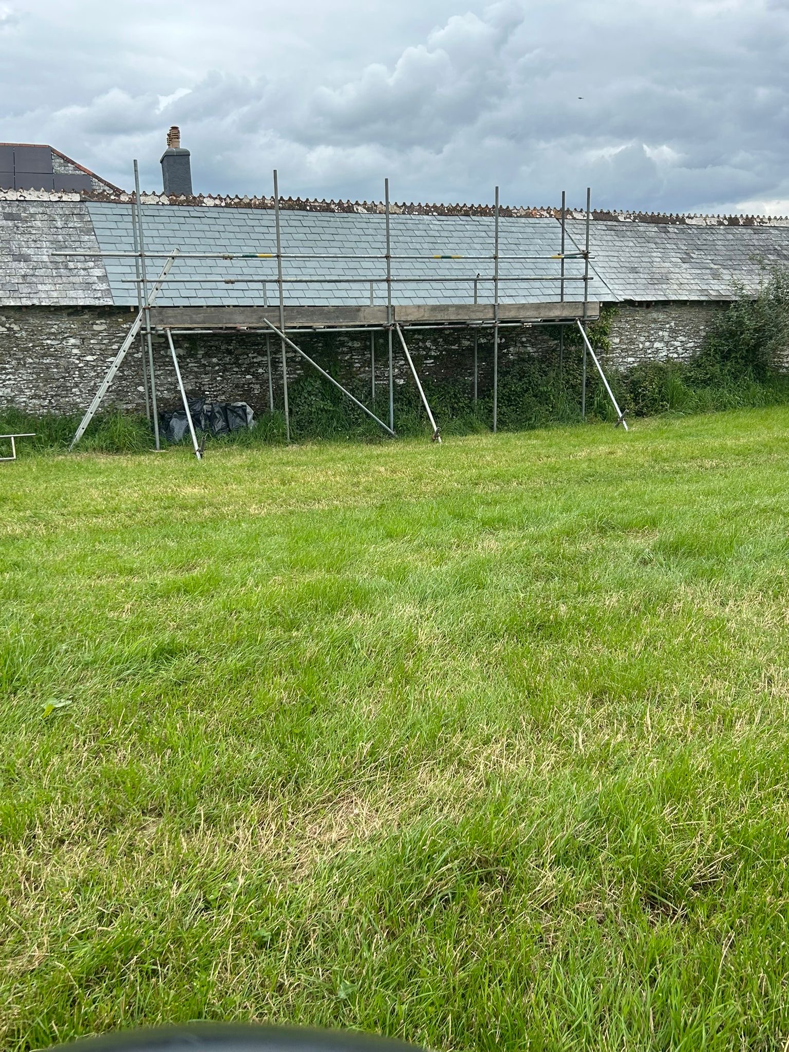 Scaffolded roof and chimney detail by NAC Roofing